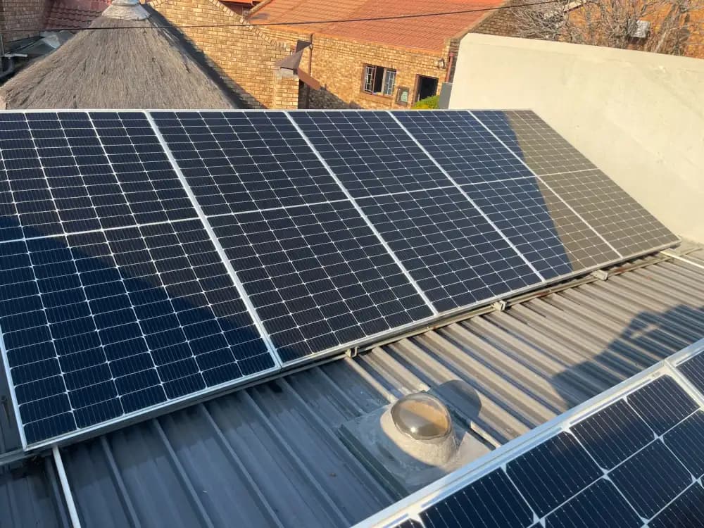 The same metal-roof solar panels restored after pure-water cleaning